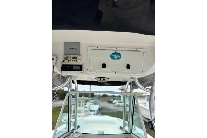 Slide: The Image of Control panel of 2013 Wellcraft 30 Scarab Sport with Garmin navigation system. - 7