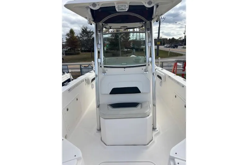 Slide: The Image of 2013 Wellcraft 30 Scarab Sport boat seats, featuring sleek white and black design. - 9