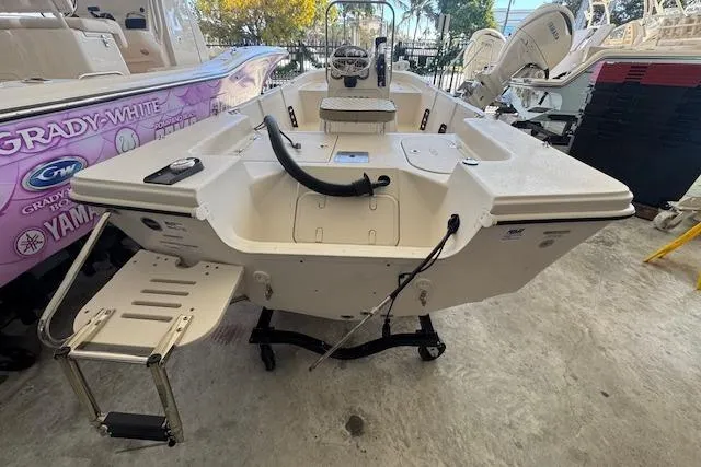 Slide: The Image of 2023 Carolina Skiff 162 JLS boat with rear view, ladder, and console. - 14