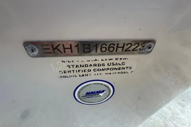 Slide: The Image of 2023 Carolina Skiff 162 JLS boat identification plate with NMMA certification label. - 15