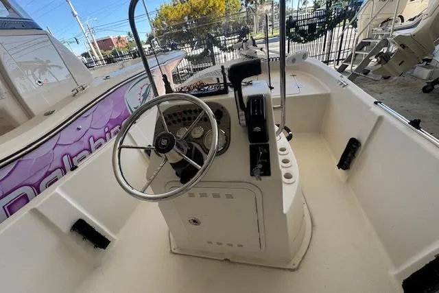 Slide: The Image of 2023 Carolina Skiff 162 JLS boat interior with steering console and controls. - 4
