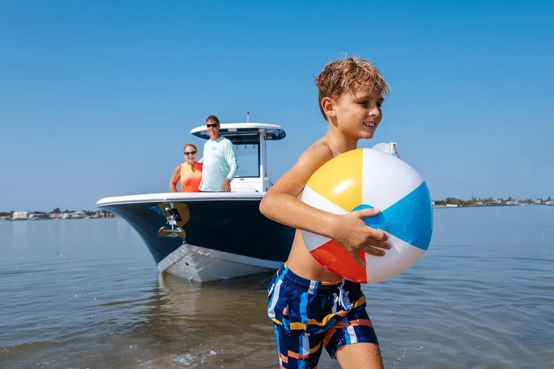 Slide: The Image of 2026 Tidewater 256 LXF boat on water near Lakeside Marina. - 10