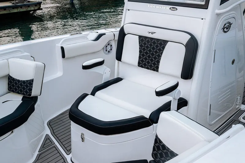 Slide: The Image of 2026 Tidewater 256 LXF boat on trailer in showroom, featuring sleek black design. - 31