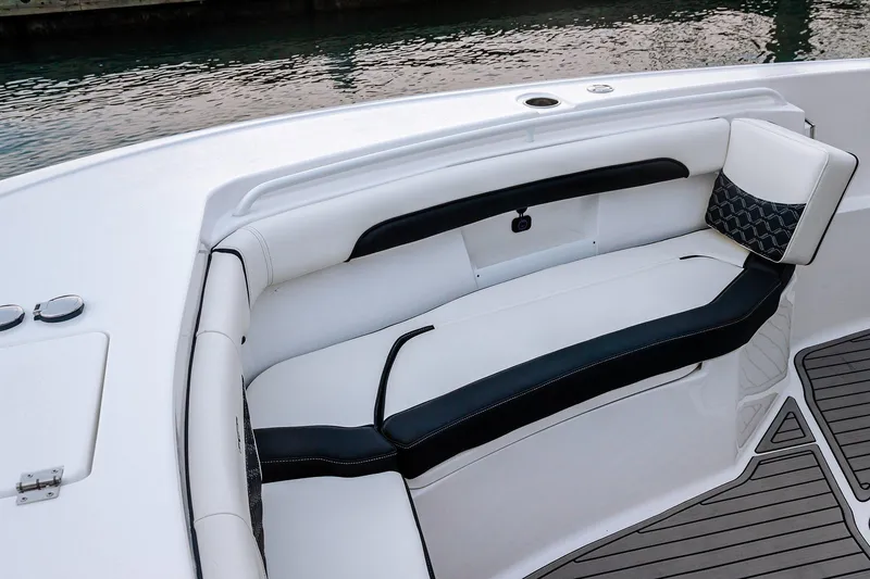 Slide: The Image of 2026 Tidewater 256 LXF boat in showroom, featuring sleek design and modern amenities. - 32