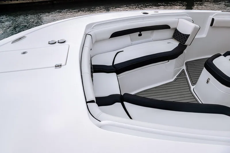 Slide: The Image of 2026 Tidewater 256 LXF boat displayed indoors on a trailer at Lakeside Marina. - 33