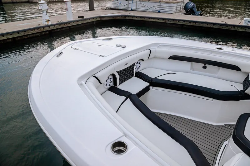 Slide: The Image of 2026 Tidewater 256 LXF boat with dual engines displayed at Lakeside Marina showroom. - 34