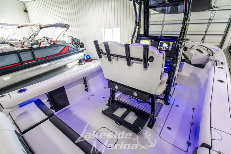 Slide: The Image of 2026 Tidewater 256 LXF boat interior with modern dashboard and seating, showcased at Lakeside Marina. - 42