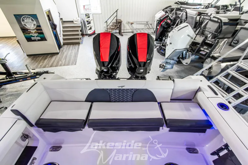 Slide: The Image of 2026 Tidewater 256 LXF boat interior with dual engines at Lakeside Marina. - 43