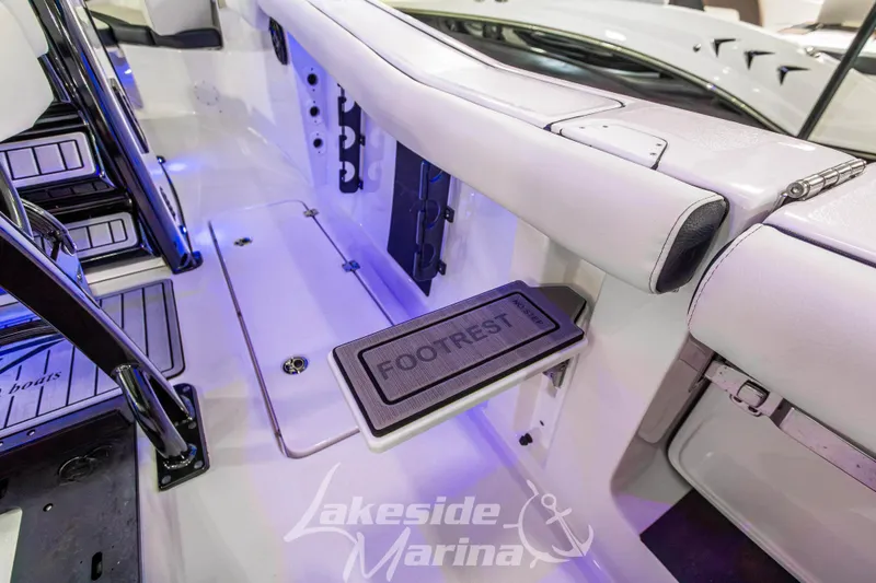 Slide: The Image of 2026 Tidewater 256 LXF boat interior with footrest and seating at Lakeside Marina. - 53