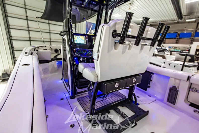 Slide: The Image of 2026 Tidewater 256 LXF boat interior with advanced navigation system and rod holders. - 57