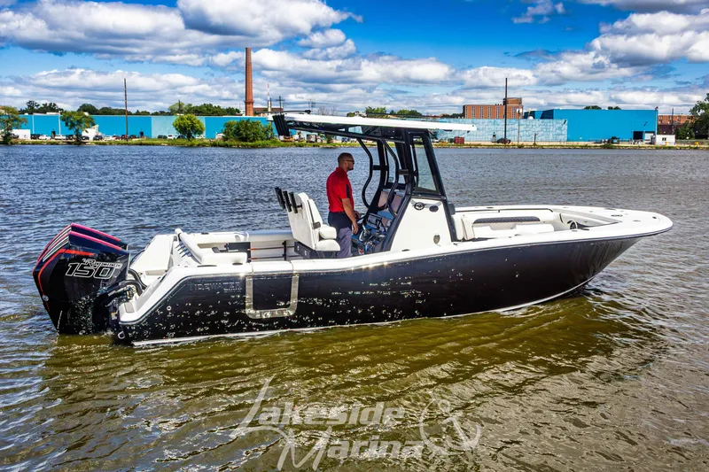 Slide: The Image of 2026 Tidewater 256 LXF boat on water, featuring sleek design and powerful engine. - 59