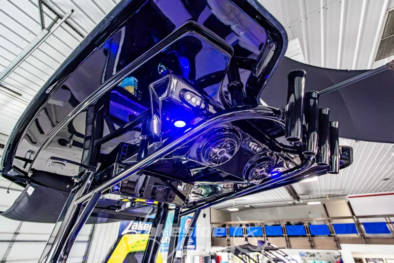 Slide: The Image of 2026 Tidewater 256 LXF boat interior with sleek design and blue LED lighting. - 63