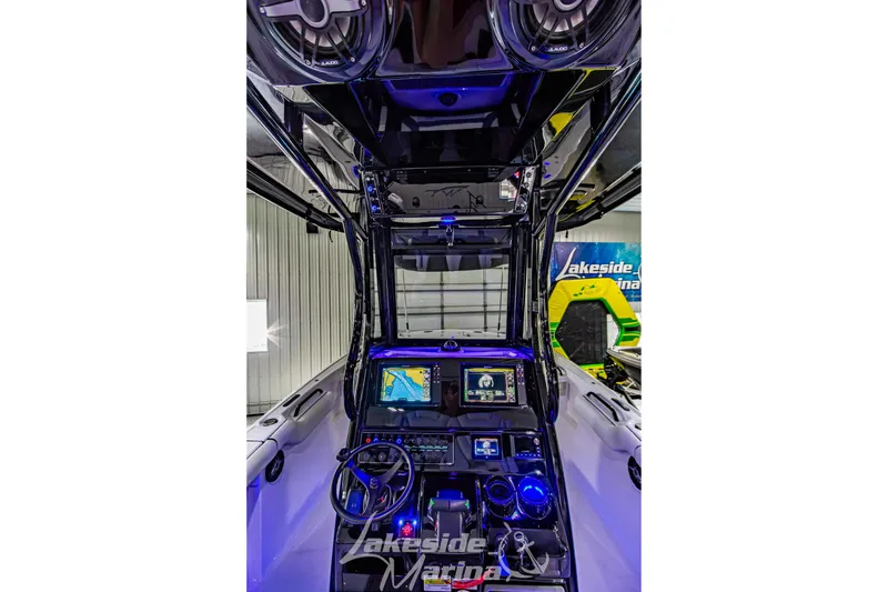 Slide: The Image of Interior view of 2026 Tidewater 256 LXF boat with advanced navigation system and controls. - 66