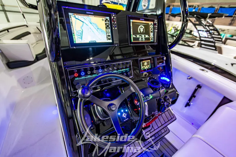 Slide: The Image of 2026 Tidewater 256 LXF boat dashboard with advanced navigation and control systems. - 68