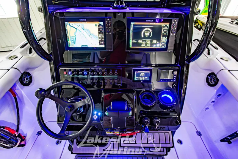 Slide: The Image of 2026 Tidewater 256 LXF boat dashboard with advanced navigation and control systems. - 70