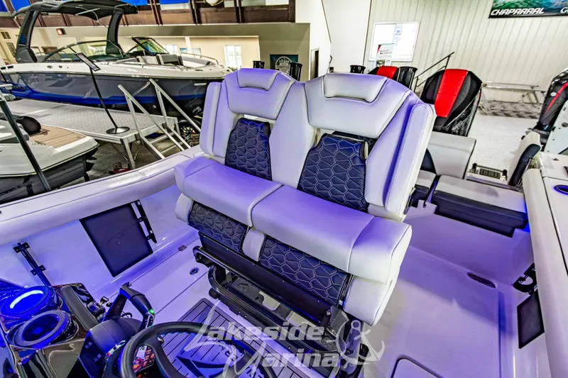 Slide: The Image of 2026 Tidewater 256 LXF boat interior with luxurious seating and modern design. - 73