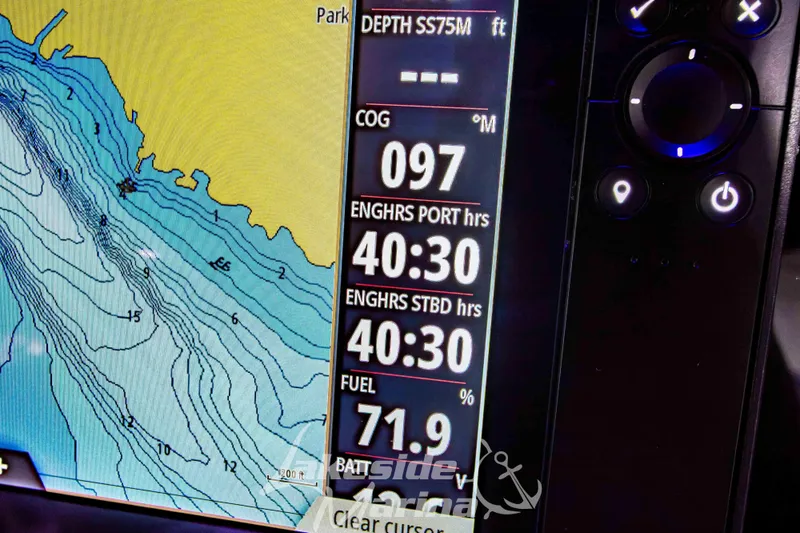 Slide: The Image of Close-up of a 2026 Tidewater 256 LXF boat's navigation display showing depth and engine hours. - 74