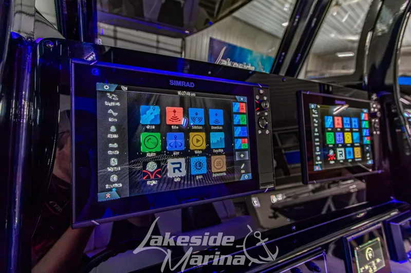 Slide: The Image of 2026 Tidewater 256 LXF boat dashboard with dual Simrad displays at Lakeside Marina. - 75