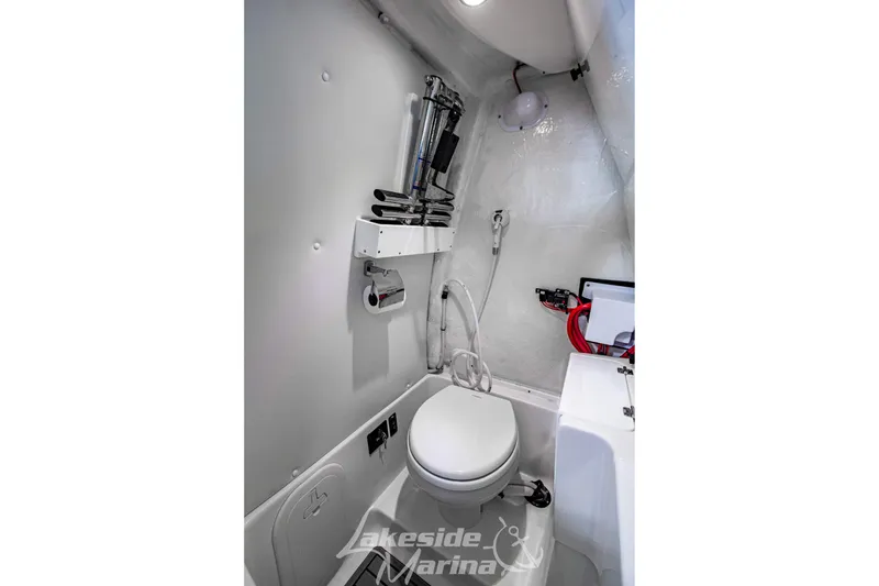 Slide: The Image of 2026 Tidewater 256 LXF boat interior bathroom with toilet and modern fixtures. - 80