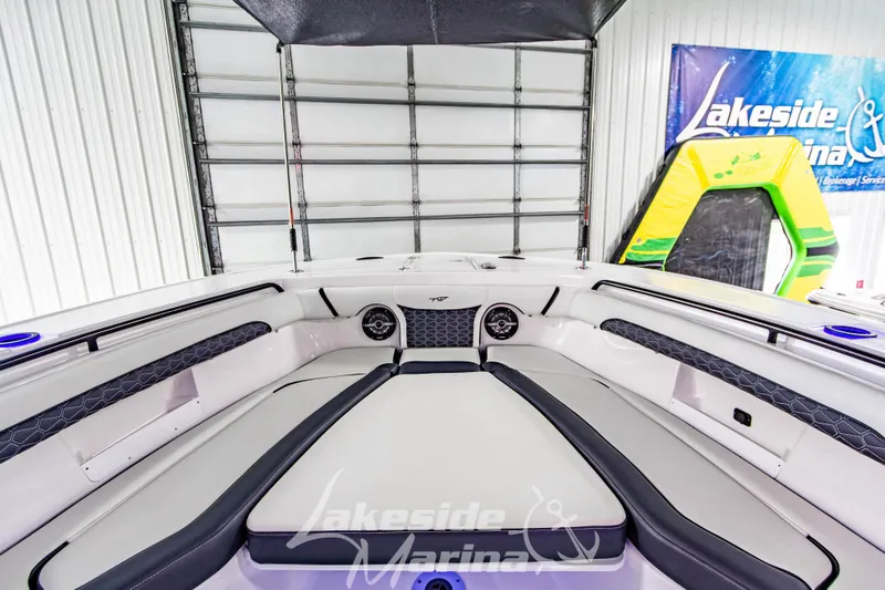 Slide: The Image of 2026 Tidewater 256 LXF boat interior at Lakeside Marina, featuring sleek seating and modern design. - 86