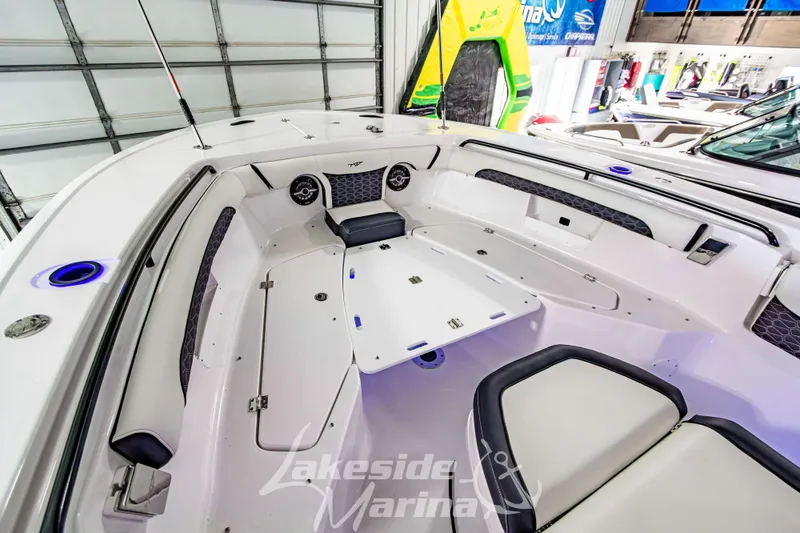 Slide: The Image of 2026 Tidewater 256 LXF boat interior with seating and table at Lakeside Marina. - 92