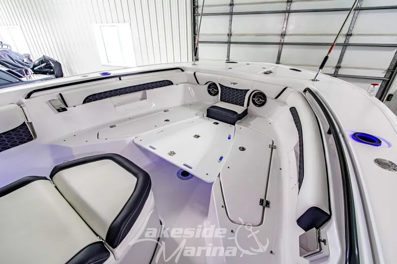 Slide: The Image of 2026 Tidewater 256 LXF boat interior with seating and storage, Lakeside Marina. - 93