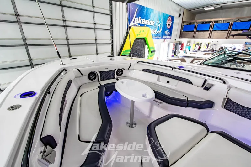 Slide: The Image of 2026 Tidewater 256 LXF boat interior with seating and table at Lakeside Marina. - 94