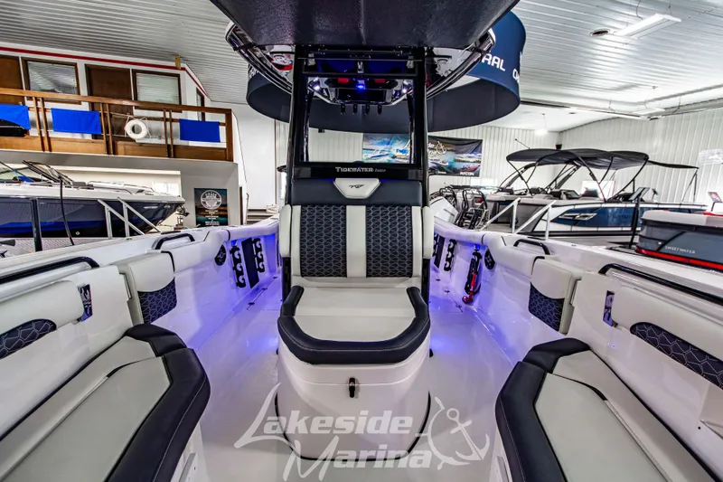 Slide: The Image of 2026 Tidewater 256 LXF boat interior with modern seating and ambient lighting at Lakeside Marina. - 97