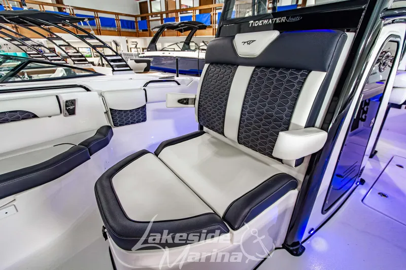 Slide: The Image of 2026 Tidewater 256 LXF boat interior with luxurious seating at Lakeside Marina. - 99
