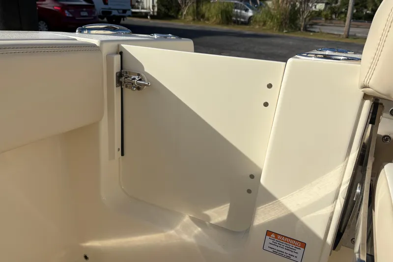 Slide: The Image of Interior view of 2026 Scout 240 XSF boat, featuring sleek, cream-colored design elements. - 13