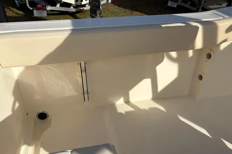 Slide: The Image of 2026 Scout 240 XSF boat interior with helm and Igloo cooler. - 15