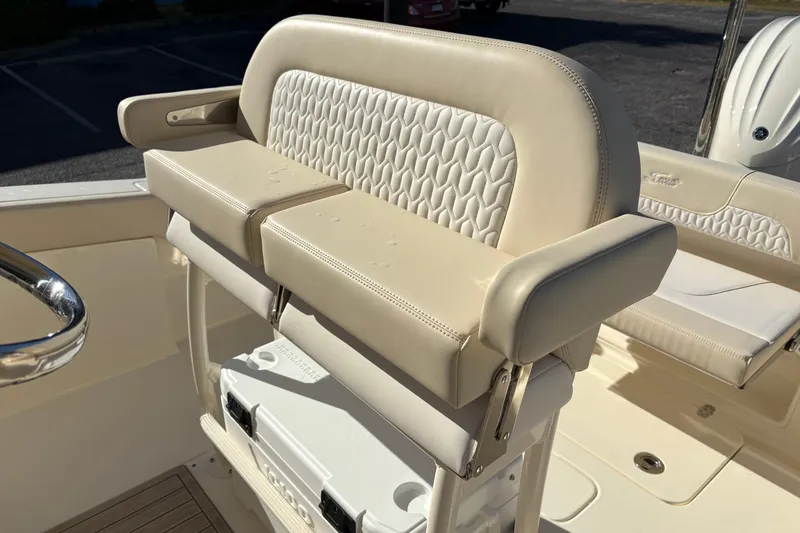 Slide: The Image of Luxury seating on 2026 Scout 240 XSF boat, featuring elegant beige upholstery. - 17