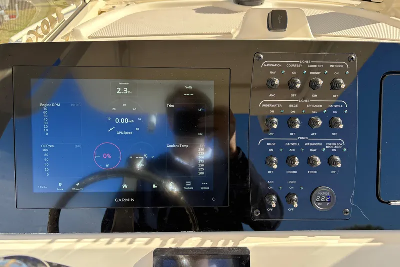 Slide: The Image of 2026 Scout 240 XSF dashboard with Garmin display and control panel. - 22