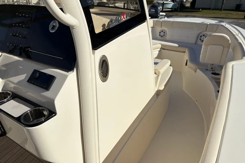 Slide: The Image of Interior view of 2026 Scout 240 XSF boat, featuring sleek design and seating area. - 24