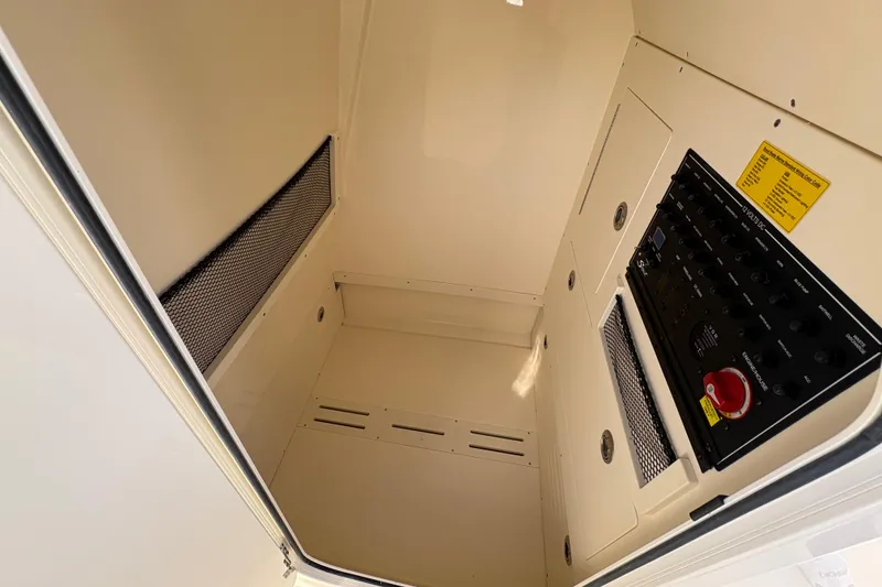 Slide: The Image of Interior view of 2026 Scout 240 XSF boat compartment with control panel. - 26