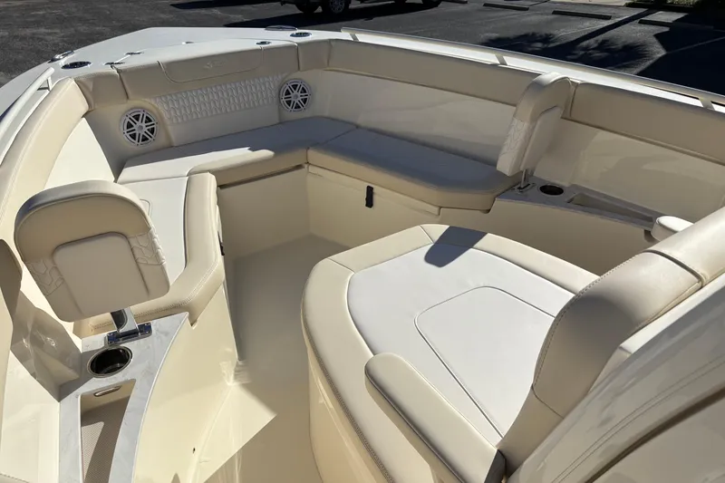 Slide: The Image of 2026 Scout 240 XSF boat interior with luxurious seating and cup holders. - 27