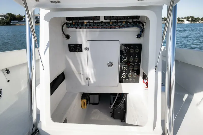 Slide: The Image of Control panel of 2025 Conch 27 boat, featuring electrical components and wiring. - 23