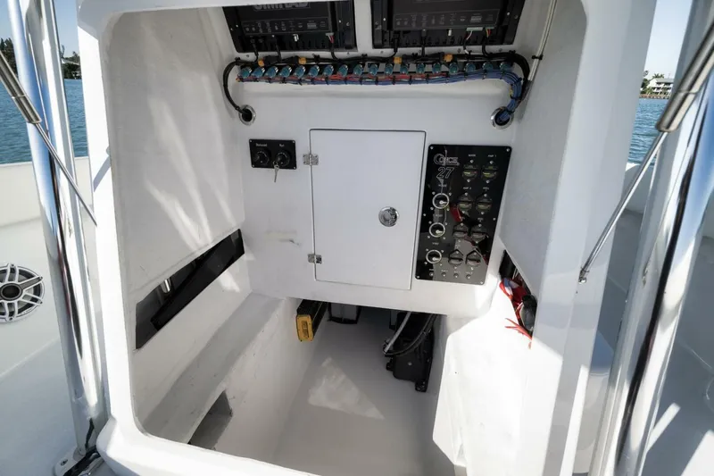 Slide: The Image of 2025 Conch 27 boat interior with control panel and wiring. - 24