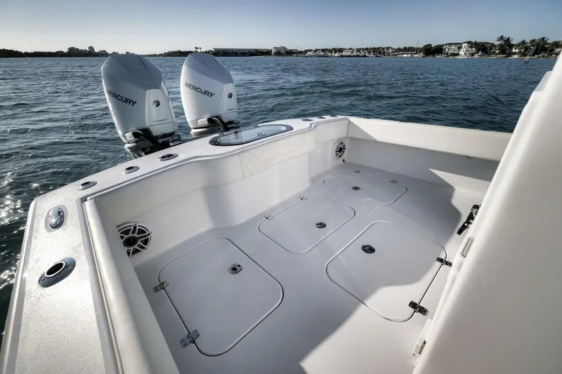 Slide: The Image of 2025 Conch 27 boat with twin Mercury engines on open water. - 31