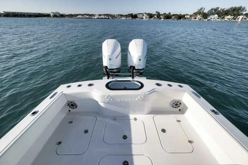 Slide: The Image of 2025 Conch 27 boat with dual engines on calm water. - 32