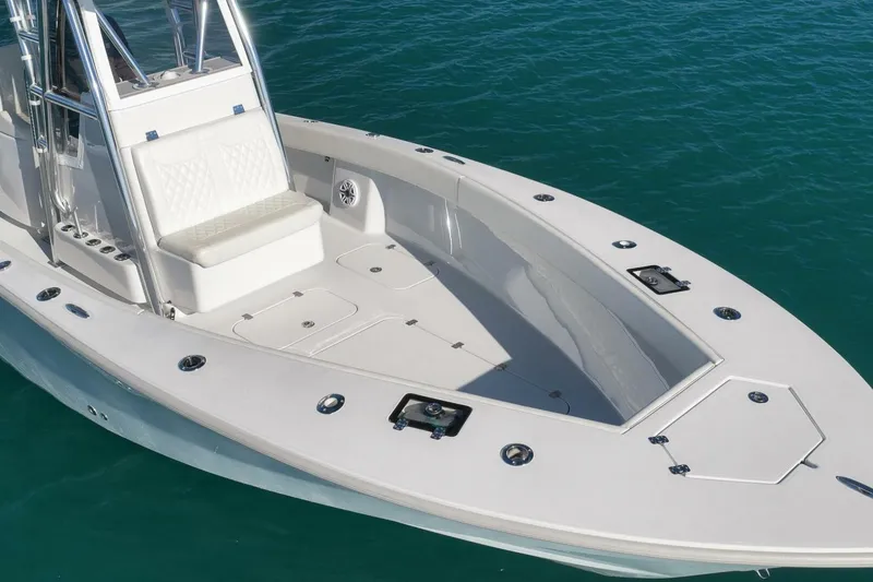 Slide: The Image of 2025 Conch 27 boat with sleek design on clear blue water. - 42