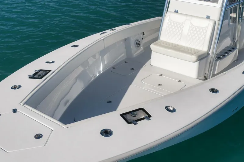 Slide: The Image of 2025 Conch 27 boat with sleek design and spacious seating on calm water. - 43