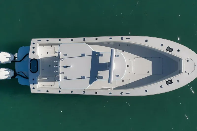 Slide: The Image of Overhead view of 2025 Conch 27 boat on clear water. - 44