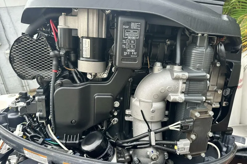 Slide: The Image of Close-up of a 2020 NauticStar 2140 Sport Shallow Bay boat engine components. - 16