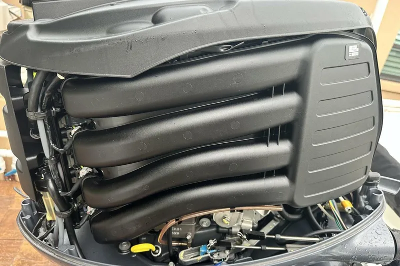 Slide: The Image of Close-up of a 2020 NauticStar 2140 Sport Shallow Bay boat engine components. - 17