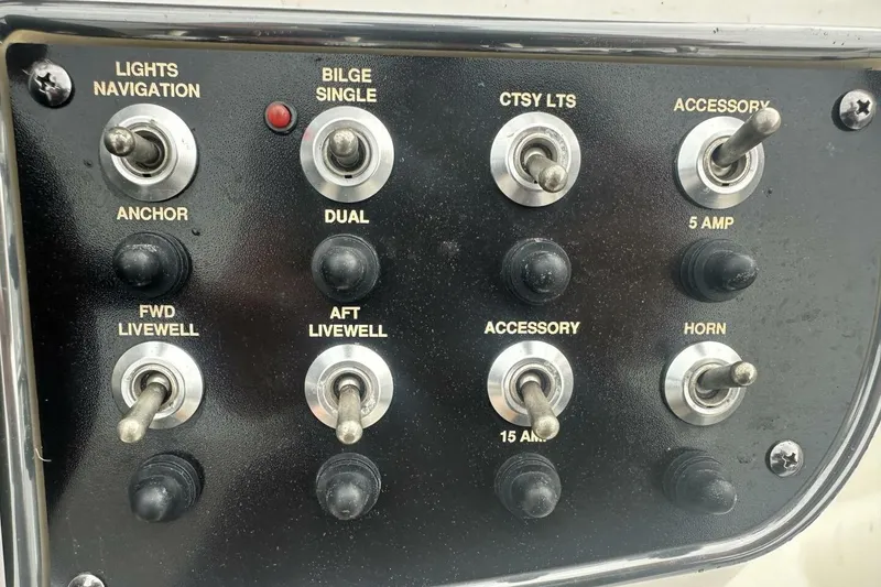 Slide: The Image of Control panel of 2020 NauticStar 2140 Sport Shallow Bay boat with switches and labels. - 23
