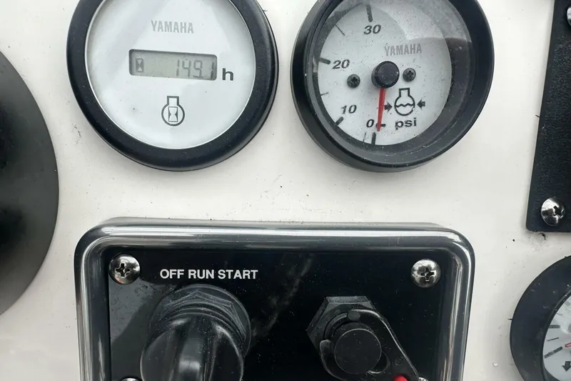 Slide: The Image of Yamaha gauges and ignition on 2020 NauticStar 2140 Sport Shallow Bay boat dashboard. - 24