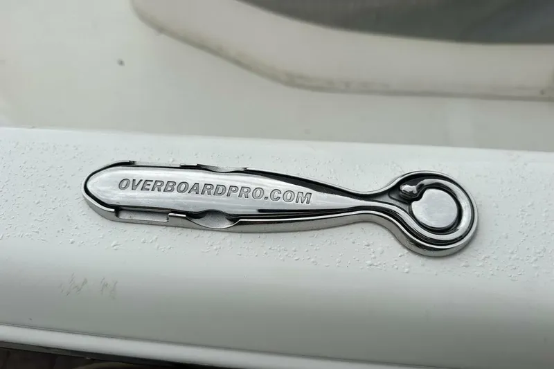 Slide: The Image of Chrome boat accessory with "OVERBOARDPRO.COM" engraving on NauticStar 2140 Sport Shallow Bay, 2020. - 25