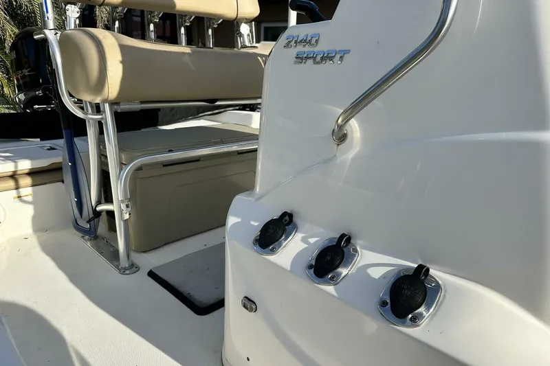 Slide: The Image of 2020 NauticStar 2140 Sport Shallow Bay boat interior with seating and control panel. - 28