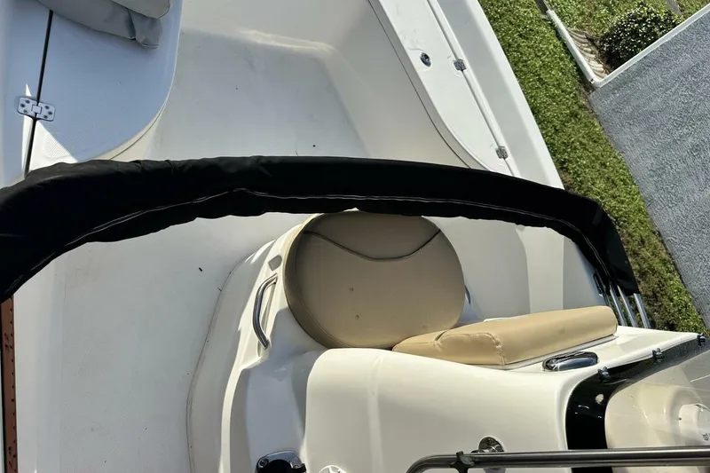 Slide: The Image of 2020 NauticStar 2140 Sport Shallow Bay boat interior with seating and railing. - 29